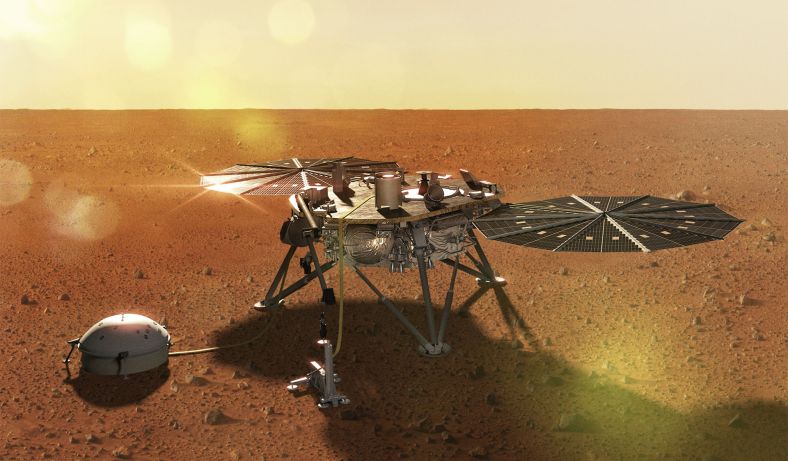 这张想象图描绘了洞察号在火星表面展开科学设备后的样子。